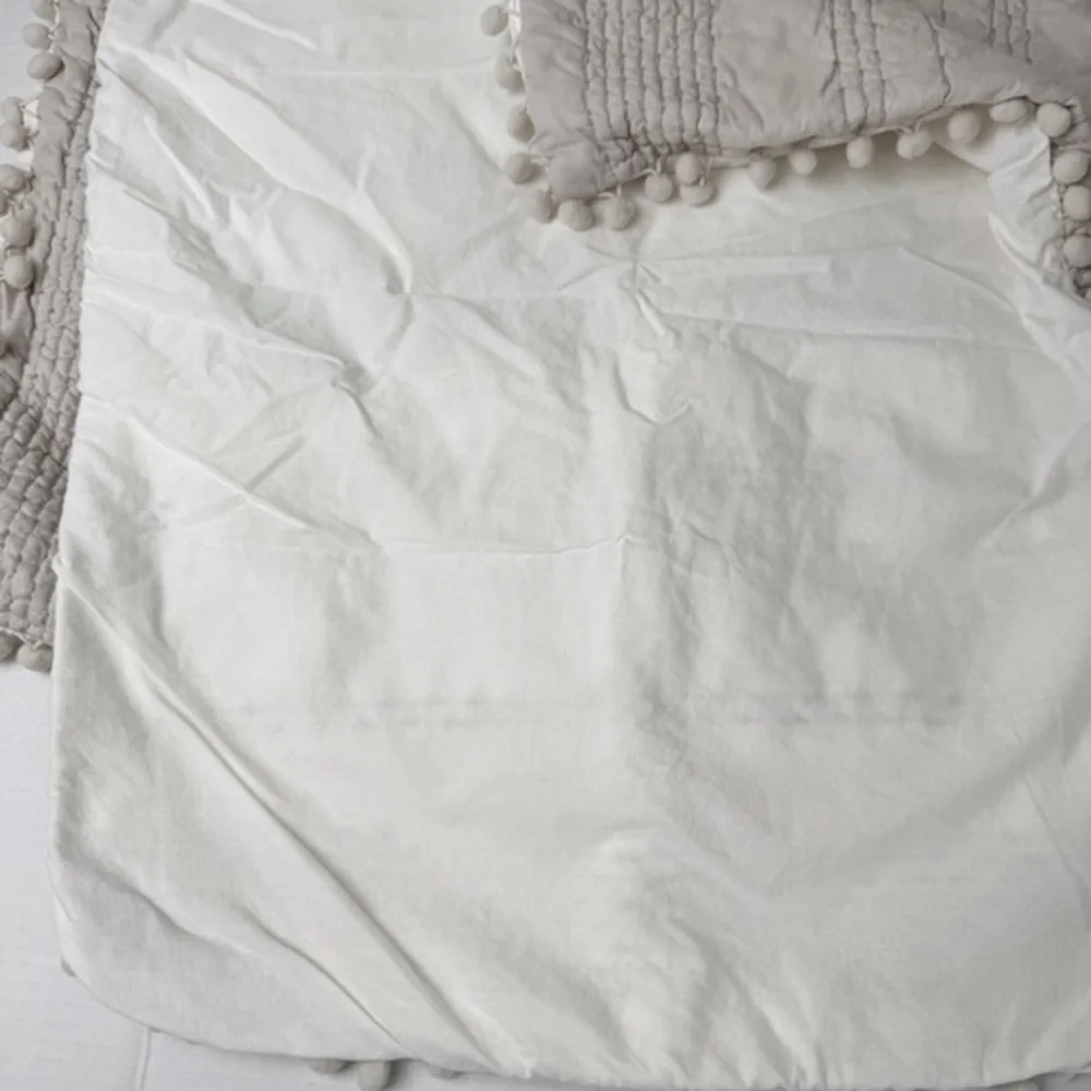 2 Bee & Willow gray quilted tassel standard pillow shams